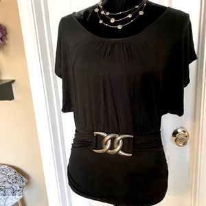 Black scoop neck top with faux gold belt.